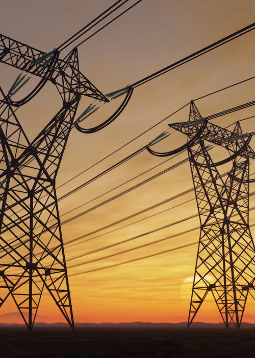Electric power lines at sunset