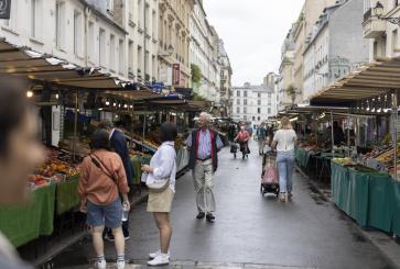 A street closed off for pedestrians to explore a market in Paris
