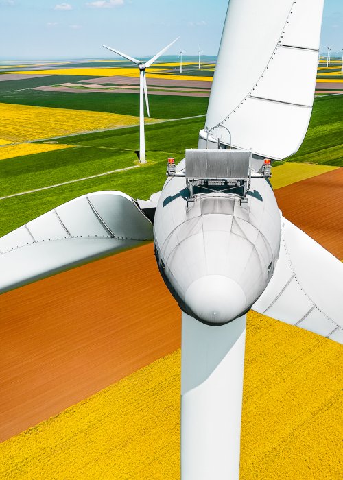 Aerial view of wind turbine on agricultural field