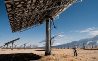 Worker in desert solar field.