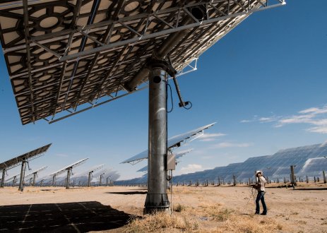 Worker in desert solar field.