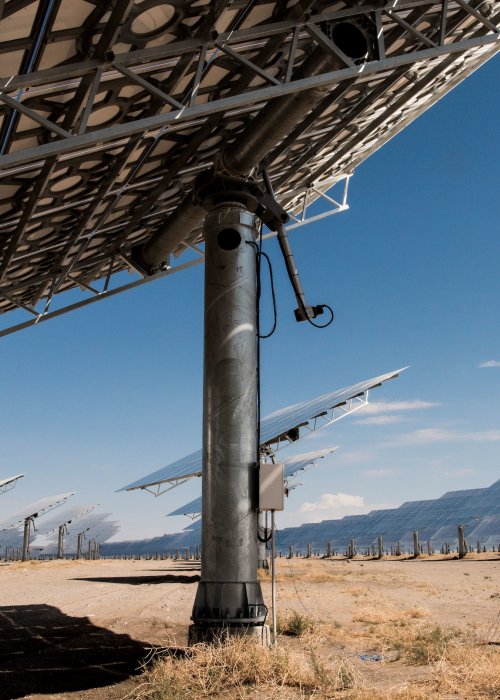 Worker in desert solar field.