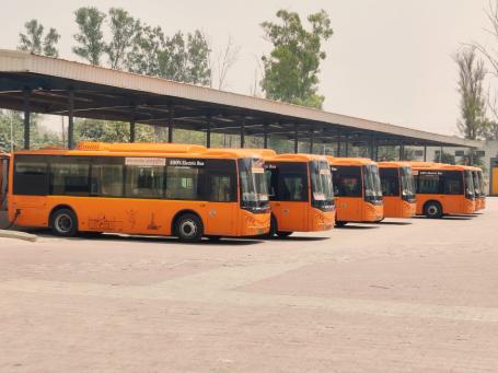 Electric Buses in India are lined up at a charging station.