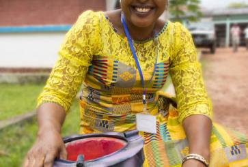 A woman holding a fuel efficient stove