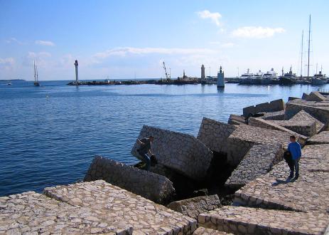 While many coasts are lined with artificial breakwaters, restoring coastal wetlands would also protect shores at a significantly lower cost. Photo credit to Mikko Lahti/Flickr