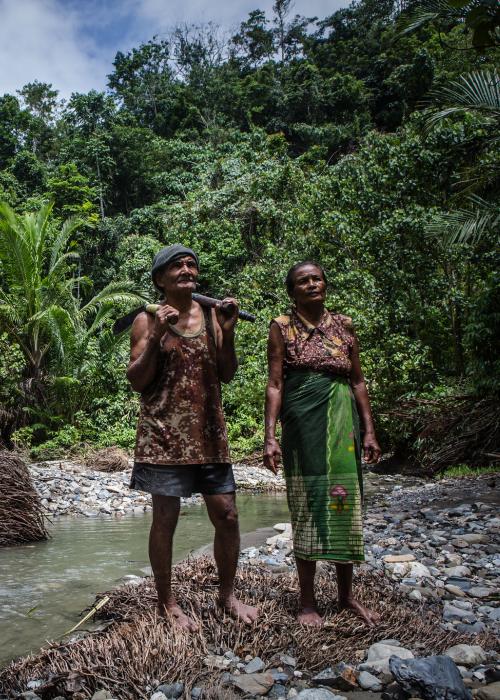 Silas Matoke and his wife Yordana Yawate, pose for photograph as they harvesting sago known as 'pangkur' on the banks of the Tuba river in Honitetu village, West Seram regency, Maluku province, Indonesia on August 22, 2017.