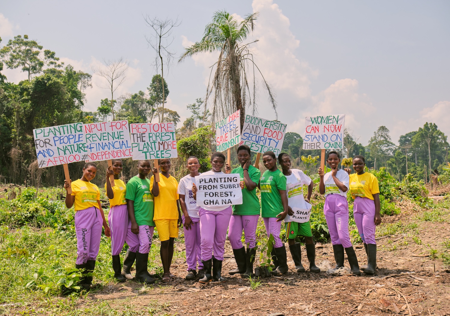 Goshen Global Vision group of women holding signs.