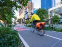 Bike rider on a green urban bike lane