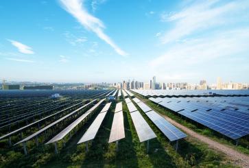 Solar panels with the cityscape of Los Angeles in the background