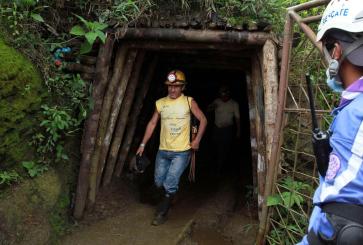 Miner coming out of cave