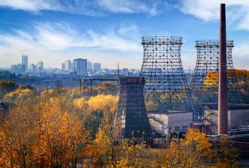 View of industrial structures with view of city