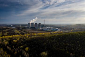 View of forest, agricultural fields, and industrial power generation