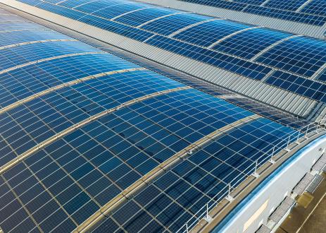 Large solar panels on roofs of industrial units and warehouses