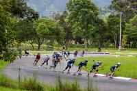 A group of people rollerblade on a pathway in Loja, Ecuador.