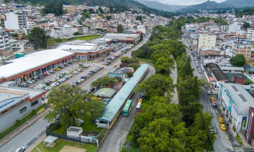A tree-lined river runs through the city of Loja.