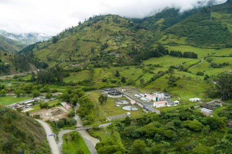 City's infrastructure buildings are woven into the green hillsides of Loja.