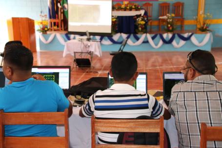 Workshop participants on laptops.