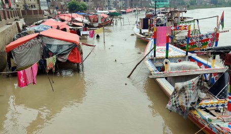 Flood waters soak through a housing settlement in Pakistan.