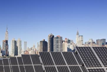 Roof top solar installation with Midtown Manhattan view as background.