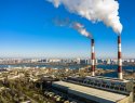A smokestack of a garbage incineration plant against the backdrop of the city