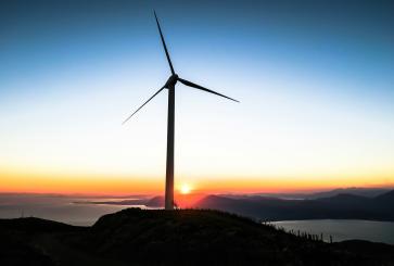  silhouette of wind mill during golden hour in Greece