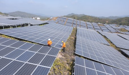 Workers clean solar panels in China