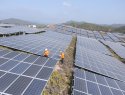 Workers clean solar panels in China
