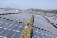 Workers clean solar panels in China