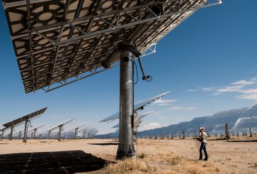 An employee runs diagnoses on heliostats at the Crescent Dunes Solar Thermal Facility.