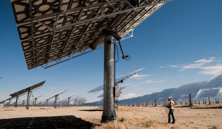 An employee runs diagnoses on heliostats at the Crescent Dunes Solar Thermal Facility.