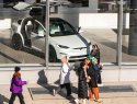 People walk by a Tesla showroom in New York City.