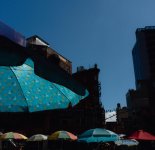 Table umbrellas on hot day.