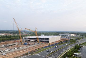 Yellow cranes rise above a data center being constructed in Virginia.