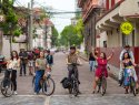 A group of cyclists celebrate people-centered streets in Manila