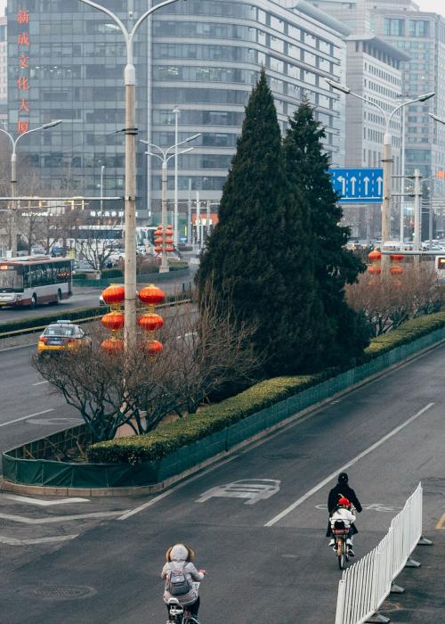 Roads with buses, cyclists and pedestrians in Beijing.